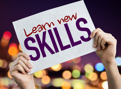 Learn New Skills placard with night lights on background